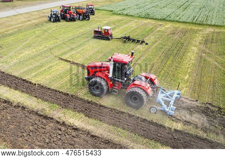 A Large Agricultural Machine Cultivates The Land. The View From The Top. Plowing Land For Planting C