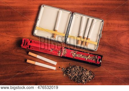 The Concept Of Making Economical Cigarettes. Cigarette Making Machine And Cigarette Tube.