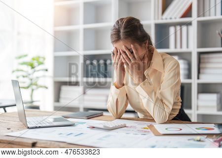 Tired Business Woman Sleepy And Bored From Sitting At A Desk For A Long Time And Has Office Syndrome