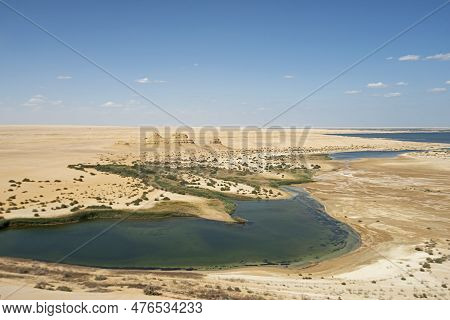 Panoramic Aerial View Over Remote African Egyptian Desert Landscape Valley With Oasis Salt Lake And 