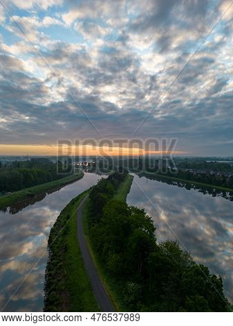 Aerial View Of A Colorful Dramatic Sunrise Sky Over The River Nete In Duffel, Belgium. River With Wa