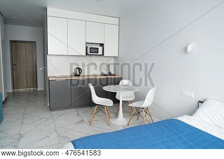 Modern Interior Of Tiny Studio Appartment. Modern Bedroom And Kitchen In Tiny Home