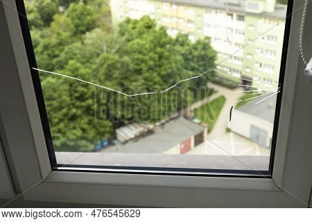 Crack, Broken Glass In A Double-glazed Window Due To Manufacturing Defect Or Temperature Difference 