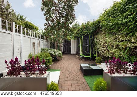 Cambridge, Cambridgeshire, England - June 8 2018: Landscaped Urban Ciity Patio Garden With Furniture
