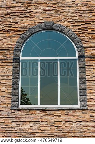 Beautiful Arched Window In Building, View From Outdoors. White Painted Wood Arched Window In A Red S