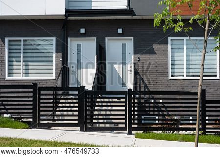 Modern Condo Entrance. Typical Facade Of A Modern Town Suburban House In Neighborhood Of British Col