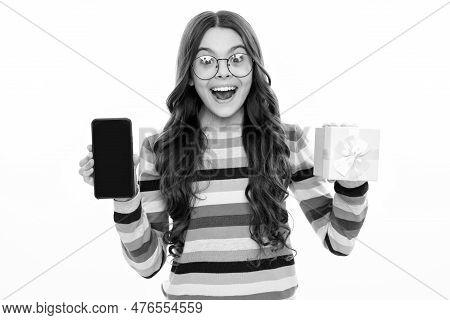 Birthday Present, Bonus For Mobile User. Portrait Of Teenager Child Girl Holding Gift Box And Cell P