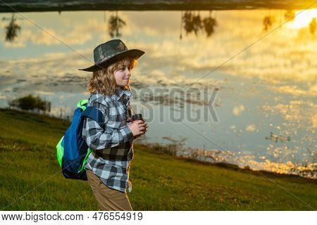 Child With Backpack, Traveller Or Explorer. Concept Of Exploration And Discovery. Kid Travel On Natu