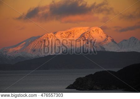 Dramatic Light And Clouds Over Snow Covered Mountain Peaks Of Northern Norway , Landscape And Nature