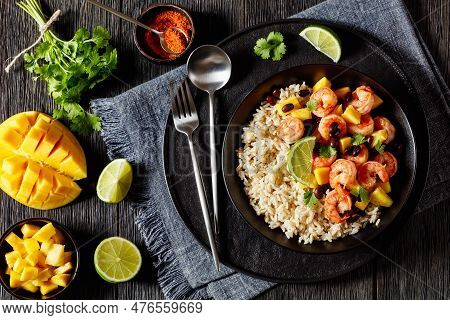 Caribbean Grilled Shrimps With Black Beans, Mango Pineapple Salsa Served With Brown Rice In Black Bo