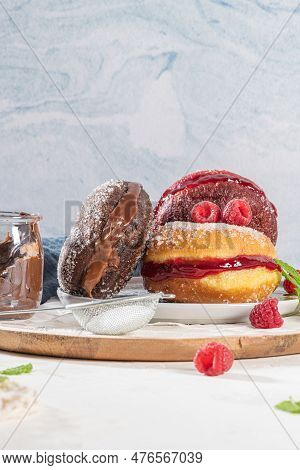 Bolas De Berlim, Or Berlin Balls. Portuguese Fried Dough With Sugar, Filled With Chocolate Or Raspbe