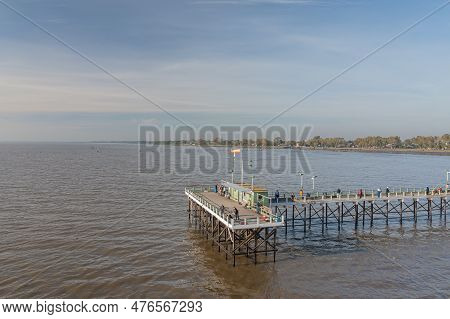 Buenos Aires, Argentina - May 16th, 2023: Fishermen On A Dock In The Rio De La Plata On The Quilmes 