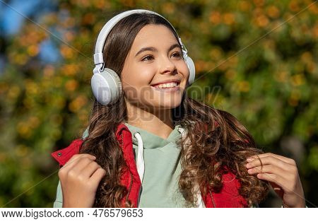 Teen Girl Listening Music Wearing Headphones. Photo Of Teen Girl Listening Music.