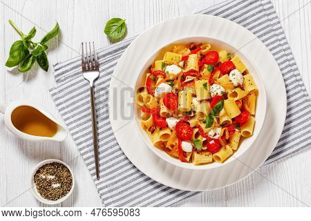 Roasted Pepper Tomato Mozzarella Pasta Salad In White Bowl On White Wood Table With Fork And Napkin,