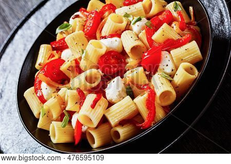 Roasted Pepper Tomato Mozzarella Pasta Salad In Black Bowl, Close-up