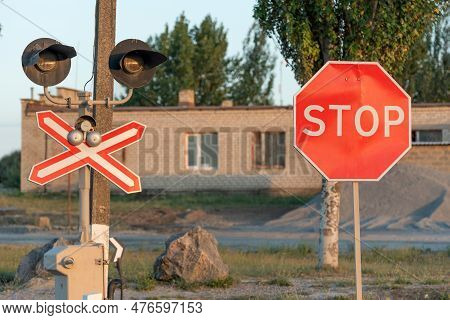 Stop Sign Near The Railway Crossing. Rules Of The Road. Level Crossing Sign. Caution Sign About Haza