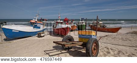 Chlopy, West Pomeranian - Poland - 2023: Fishing Boats On The Sea Shore In A Small Rural Port