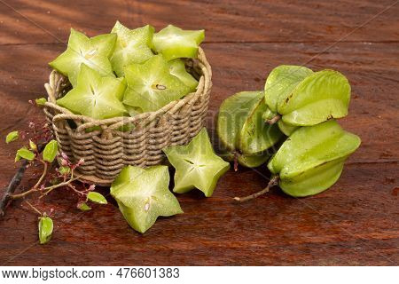 Star Fruit Or Carambola Green - Averrhoa Carambola; Photo On Wooden Background