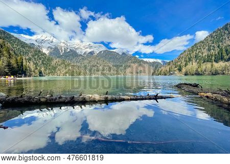 View On Lake Ritsa In Abkhazia, Georgia. Lake Ritsa Is A Lake In The Caucasus Mountains. Snow Lies O