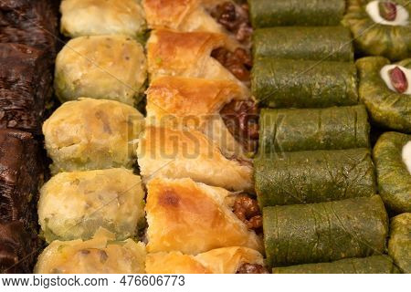 Turkish Pistachio Baklava Isolated On A White Background. A Variety Of Turkish Sweet Baklava. Walnut