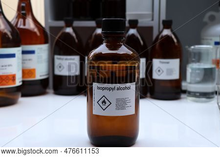 Isopropyl Alcohol In Glass,hazardous Chemicals And Symbols On Containers In Industry Or Laboratory