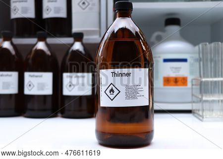 Thinner In Glass,hazardous Chemicals And Symbols On Containers In Industry Or Laboratory