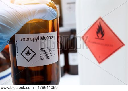 Isopropyl Alcohol In Glass,hazardous Chemicals And Symbols On Containers In Industry Or Laboratory