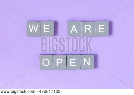 We Are Open Quote, Welcome Sign For Business Or Caffe, Wooden Letters On Violet Background, End Of Q