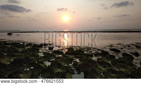 Sunset View On The Seashore. And The Sky In The Color Of The Sunset