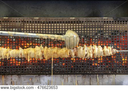 A French Spit Cake Consisting Of Layers Of Dough Placed, One At A Time, On A Rotating Spit Cooked Ro