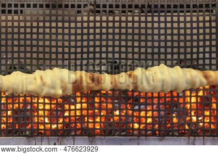 A French Spit Cake Consisting Of Layers Of Batter Placed, One At A Time, On A Rotating Spit Cooked R