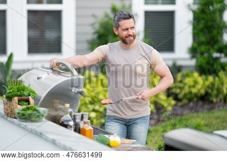 Bbq, Grilling, Barbecue Outside. Man With Barbeque Roast Fish Outdoor. Grilling And Barbecue Concept