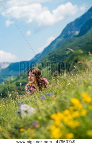 Beautiful Women Laughing And Lying On The Grass