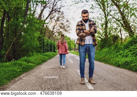 Couple Is Having Difficulties In Their Relationship. Woman Is Leaving Her Man After Argue. Conceptua