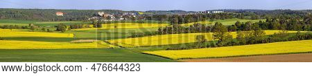 Field Of Rapeseed, Canola Or Colza In Latin Brassica Napus And Namest Nad Oslavou Castle, Czech Repu