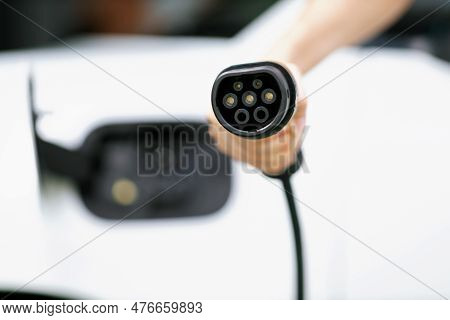 Progressive New Alternative Clean Energy Vehicle And Electric Charging Device Concept. Focus Closeup