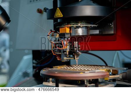 Automatic Desktop Wire Bonder Machine During Work At Exhibition Or Trade Show - Close Up. Automated 