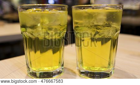 Two Glass Of Japanese Green Tea Or Ocha Tea Or Yellow Drink Tea Served In A Tall Glass. Ryokucha Jap