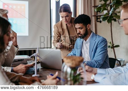 Young Colleagues Having Meeting, Consulting About Green Energy.