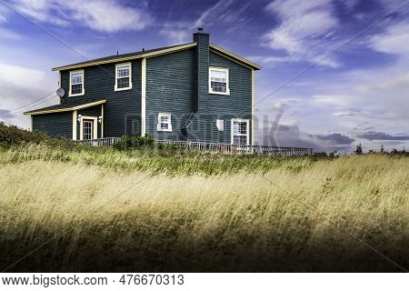 Skerwink Newfoundland Canada, September 24 2022: A Newfoundland Home With Painted Wooden Siding Over