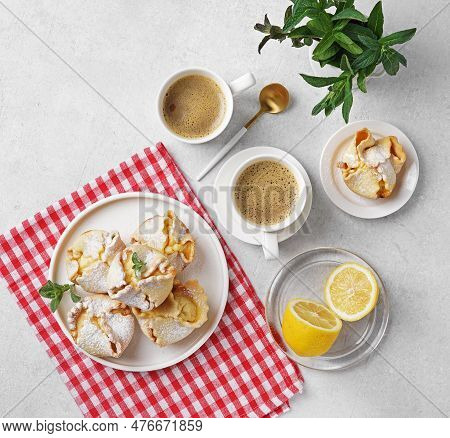 Soffioni - Traditional Ricotta Cheese And Lemon Cakes. Concept Of Sweet And Easter National Pastries