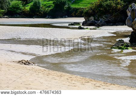View On Playa De Poo During Low Tide Near Llanes, Green Coast Of Asturias, North Spain With Sandy Be