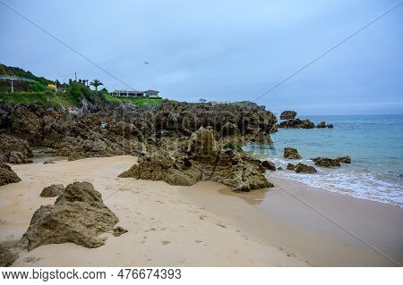 View On Playa De Toro In Llanes, Green Coast Of Asturias, North Spain With Sandy Beaches, Cliffs, Hi