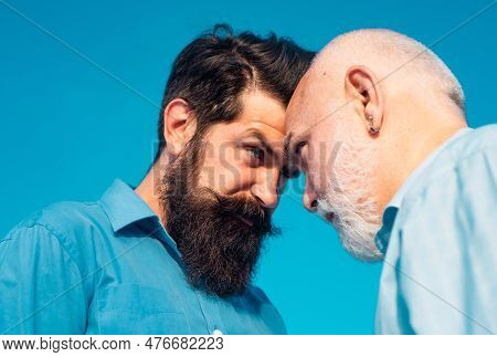 Men Generations: Grandfather And Father Together. Elderly Senior Man And Bearded Son - Two Generatio