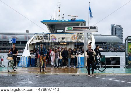 Amsterdam, The Netherlands - 8 September 2022: People Leaving A Gvb Ferryboat