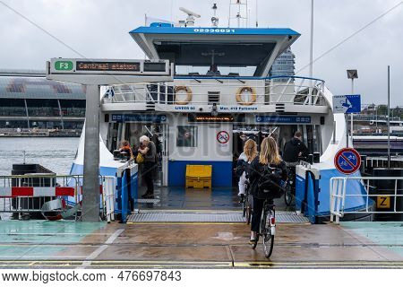 Amsterdam, The Netherlands - 8 September 2022: People Going Into A Gvb Ferryboat