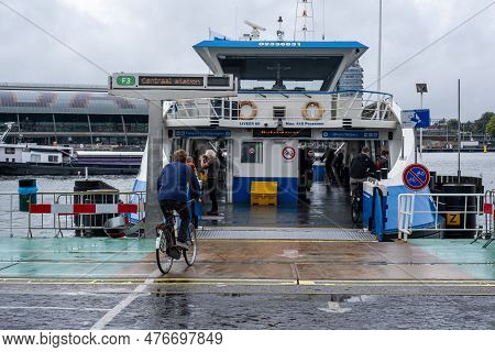 Amsterdam, The Netherlands - 8 September 2022: People Going Into A Gvb Ferryboat