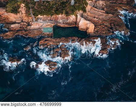 Aerial Drone View Of Blue Pool In Bermagui During Sunrise Sunset With Blue Sky And Reflection. New S