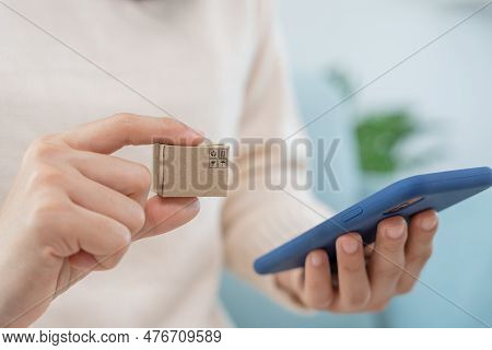 Woman Using Smartphone Doing Financial Transactions Through The Internet. Mobile Phone With Payment 