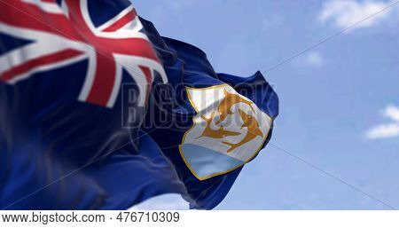 Anguilla Flag Waving In The Wind On A Clear Day. Blue Ensign With British Flag In Canton, Coat Of Ar
